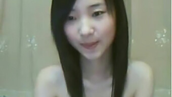 A Slender Oriental Maiden Pleasuring Herself With Her Fingers On Camera