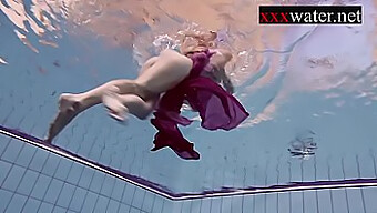 Russian Redhead In A Bikini Swims In The Pool